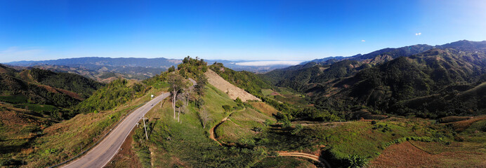 Fototapeta na wymiar Panorama drone shot aerial view landscape of mountain and nature against blue sky