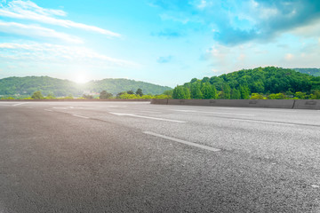 Empty asphalt road square and natural landscape under the blue sky