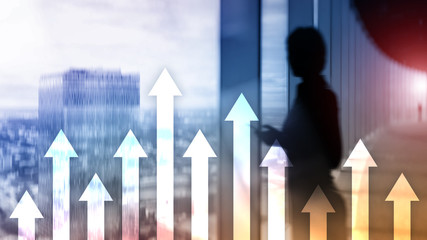 Up arrow graph on skyscraper background. Invesment and financial growth concept.