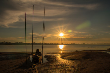 Fototapeta premium Before sunrise in morning and boat with in the beach and river background.