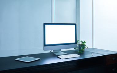 Computer and digital tablet in the modern office .