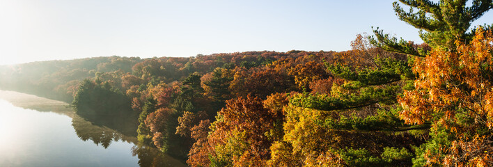 Autumn colors on the Illinois River as the morning sun lights up the tree tops.  Starved Rock State...