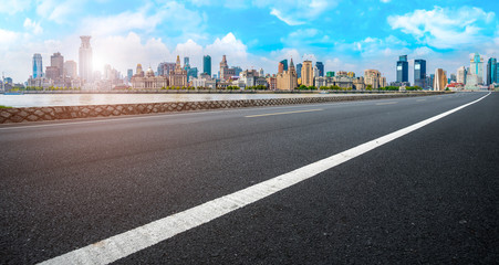 Fototapeta premium Empty asphalt road along modern commercial buildings in China,s cities