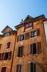 Fototapeta na wymiar Colourful rustic old buildings with red wooden windows, Vevey, Switzerland