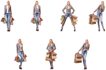 Beautiful woman with shopping bags isolated on white