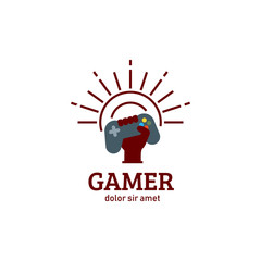 Gamer gamepad console raising hand with sunburst sunshine logo