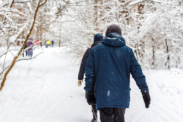 Naklejka premium Walk in the winter snow-covered wood. Beautiful winter landscape