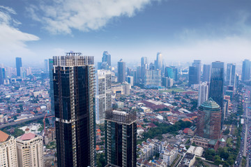 Fototapeta na wymiar Two skyscrapers under construction in Jakarta city