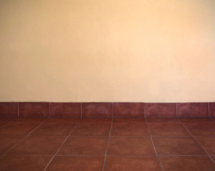 empty warm light room with wall and tilts, background of empty wall with space, colorful background in the building, background in yellow brown color