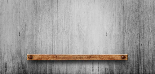 Wood shelf on brick wall. Polished cement floor. texture background. furniture