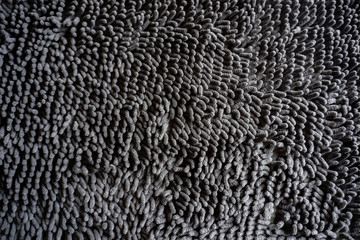 black dark color hairy fur textured carpet mat wallpaper background