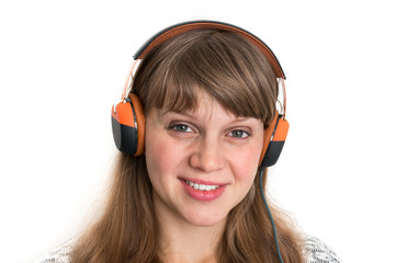 Woman with headphones is listening rock music