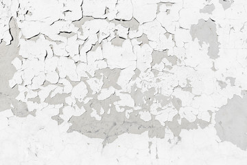Cement wall texture background with grey grungy stucco, white peeled paint, cracks and stains