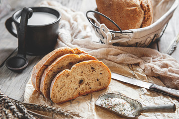 Delicious homemade sourdough rye bread on a plate and milk. Homemade baking