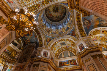 SAINT PETERSBURG, RUSSIA - January 2, 2019: Beautiful interior of the St Isaac's Cathedral. Luxurious ceiling and dome inside the famous cathedral.