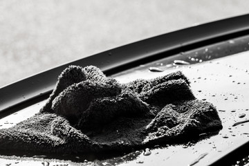Clining car. Person cleaning car with microfiber clot and maintaining shine