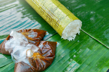 Lemang is famous traditional food in Malaysia and Indonesia made of glutinous rice cooked inside a...