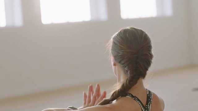 beautiful yoga woman exercising healthy lifestyle practicing side seated wide angle pose enjoying workout in studio training mindfulness breathing exercise