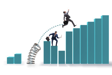 Businessman outperforming his competition jumping over