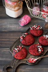 Cookies red velvet in chocolate glaze with the decor of sugar hearts