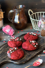 Cookies red velvet in chocolate glaze with the decor of sugar hearts