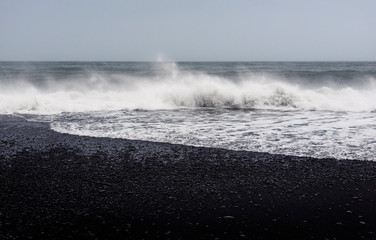Waves on Black sand Reynisfjara Beach in Iceland