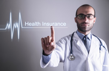 Doctor touching Health Insurance text. Healthcare concept