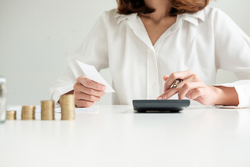 Rows of coins for finance and banking concept with business man and woman. A metaphor of international financial consulting.