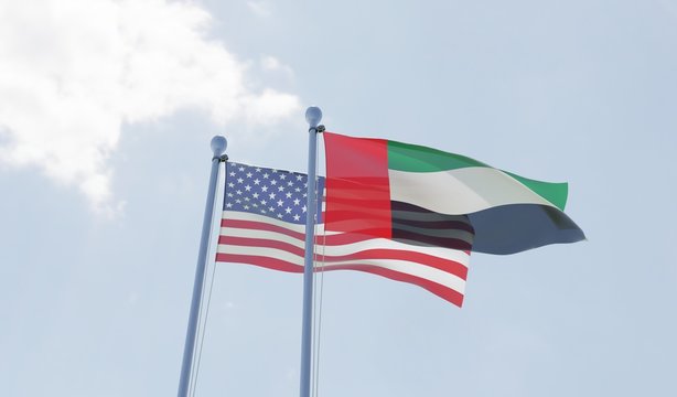 USA and UAE, two flags waving against blue sky. 3d image
