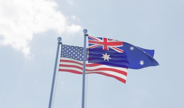 USA and Australia, two flags waving against blue sky. 3d image