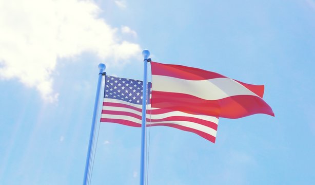 USA and Austria, two flags waving against blue sky. 3d image
