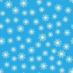 Seamless pattern. White snowflakes on a blue backgrounds. For packaging paper