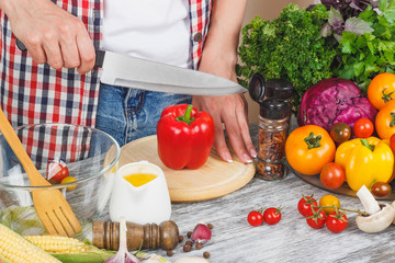 Woman cooks at the kitchen, body part, blurred background