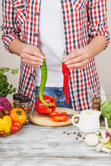 Woman cooks at the kitchen, body part, blurred background