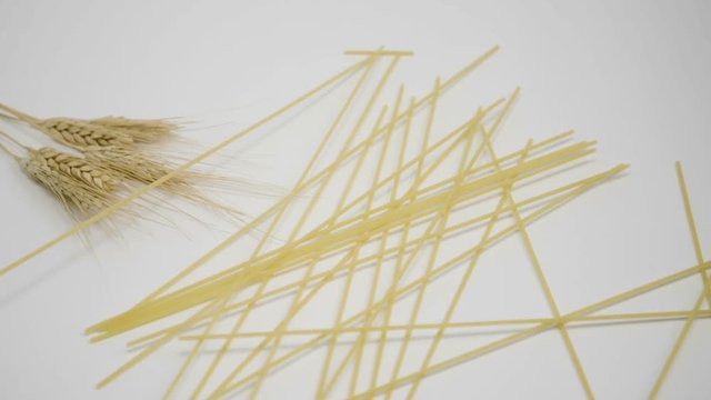 Spaghetti, noodles falling down on a wheat