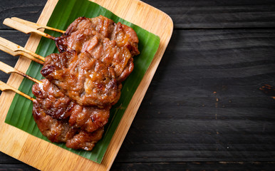 grilled skewered milk pork with white sticky rice