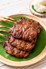 grilled skewered milk pork with white sticky rice