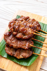 grilled skewered milk pork with white sticky rice