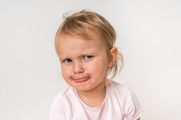 Fototapeta premium Little baby with sad expression in face
