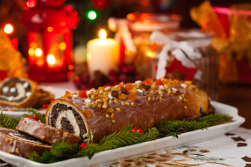 Poppy seed roulade in Christmas decoration. Served with coffee or tea.