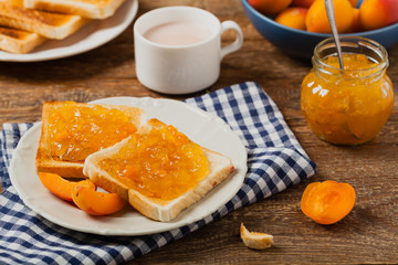 Breakfast. Toasts with cherry or peach jam and fresh fruit.