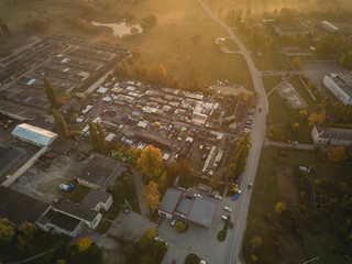 Aerial view of busy town market on early autumn sunday morning.