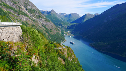 Fjord Geirangerfjord with ferry boat, Norway.