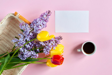 Spring background, tulips and a cup of coffee with a place for text, greeting card with the eighth of March