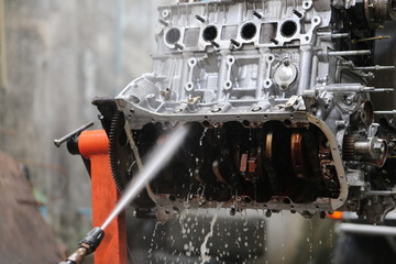 Hand cleaning car's engine