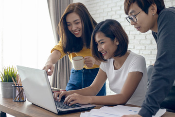 Fototapeta premium young asian woman working laptop computer on wood desk in Home office