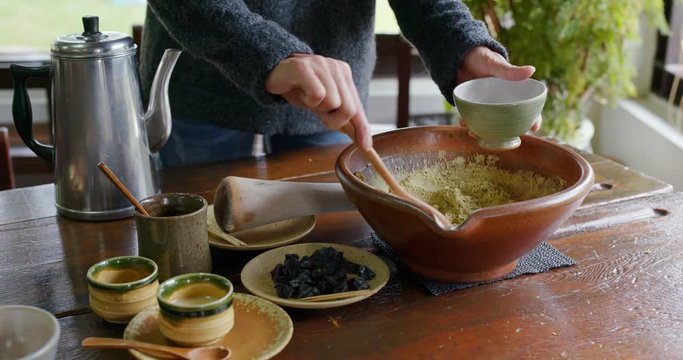 Woman making Tradition chinese ground tea