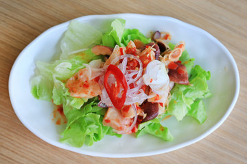 Japanese food, Spicy Octopus Tako salad on wooden table.