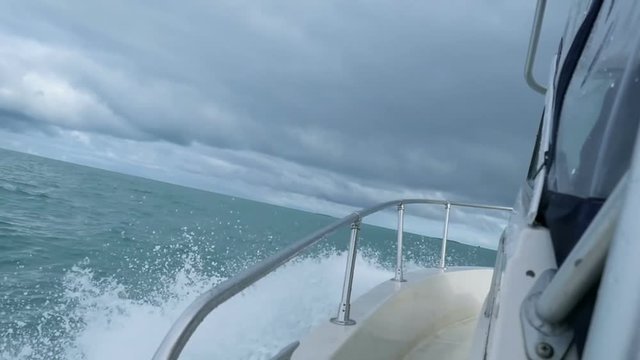 Horizon of north barents sea, slomotion waves under the motorboat
