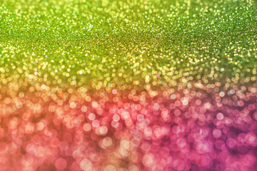 colorful glowing green and pink shiny glitters texture background for valentine 